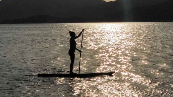 standup paddleboarding at sunset